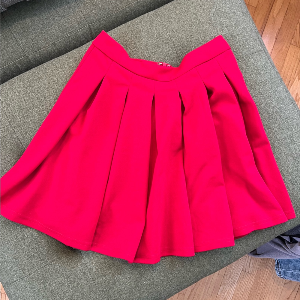 Red pleated skirt